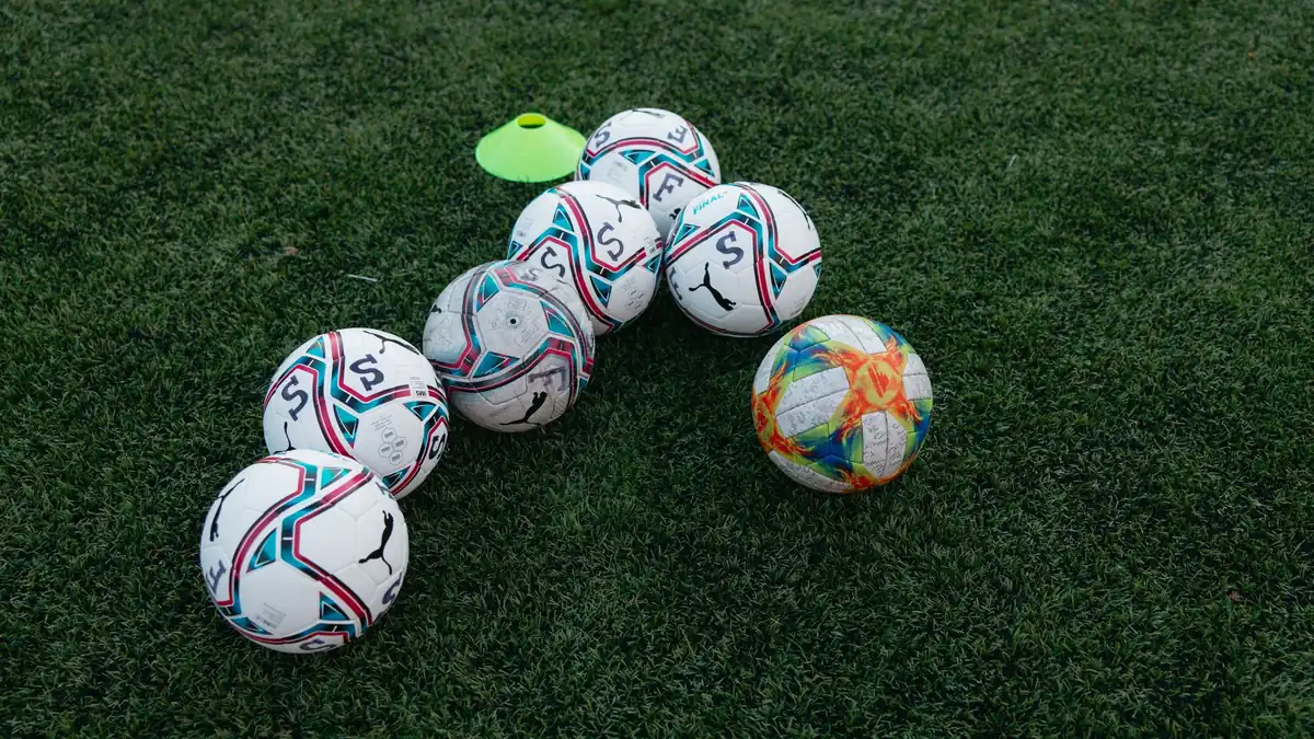 Footballs and a cone at training